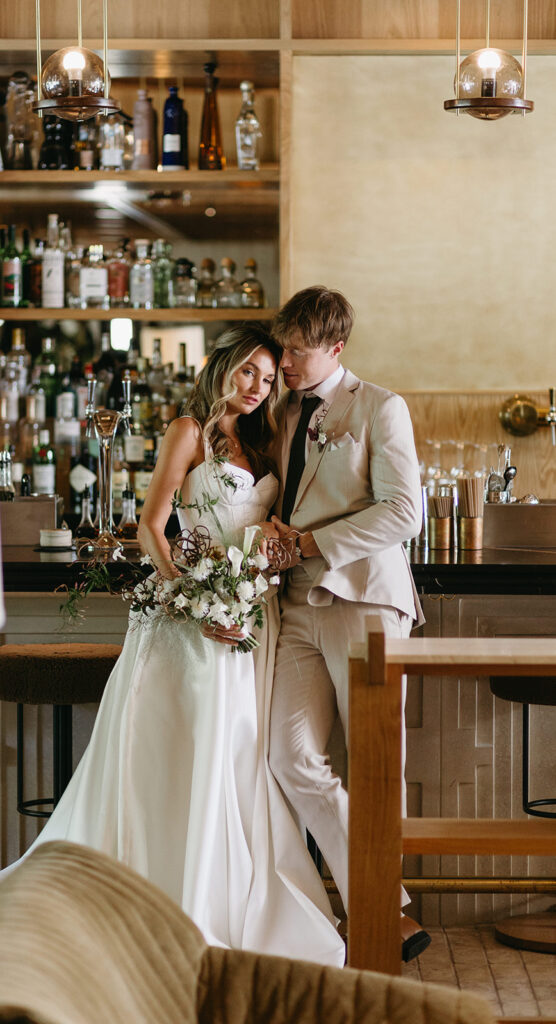Bride and groom portraits at the lobby bar of the MOLLIE Hotel in Aspen